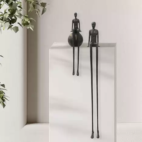 Edge Sitting Long-Legged Black Figure Sculpture - Image 4